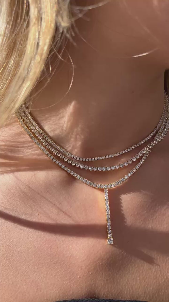 Tennis Lariat Necklace in 14k gold fill with white sapphires, featuring a vertical drop design.