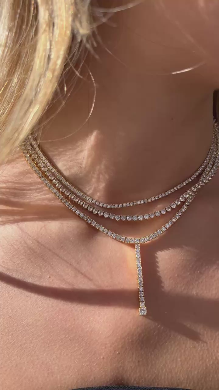 Tennis Lariat Necklace in 14k gold fill with white sapphires, featuring a vertical drop design.